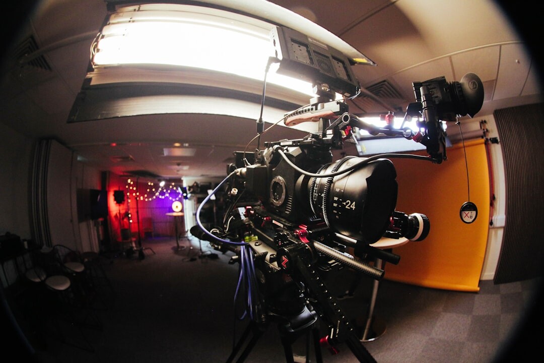 Wide angle of a television studio set with cameras and lighting rig