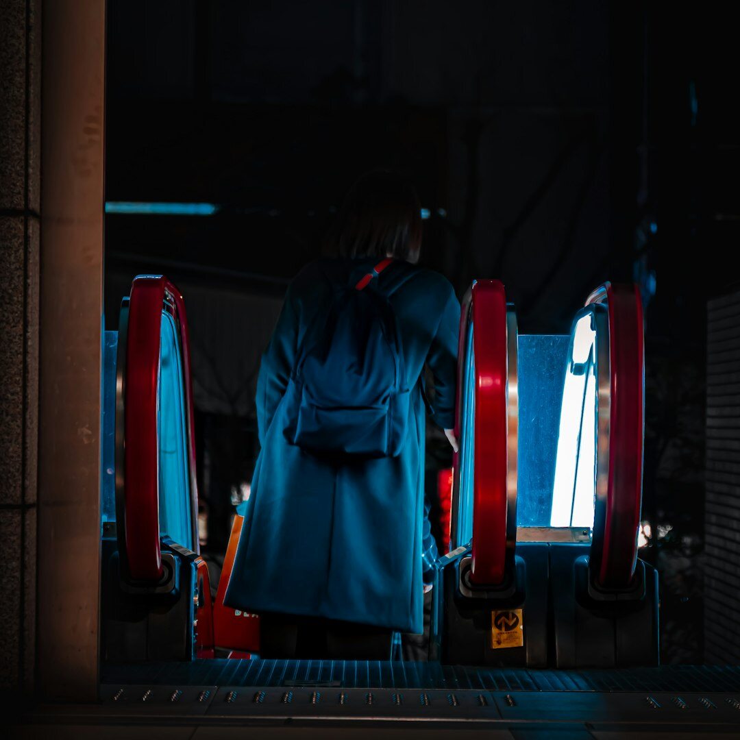 Finnish female lighting technician adjusting studio lights on a rig