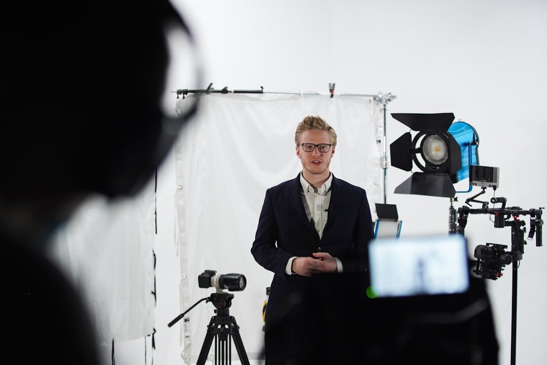 Broadcast television camera mounted on a dolly track in a studio