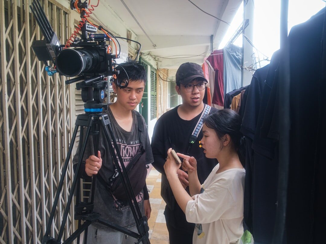 Trainee learning to operate a television studio camera