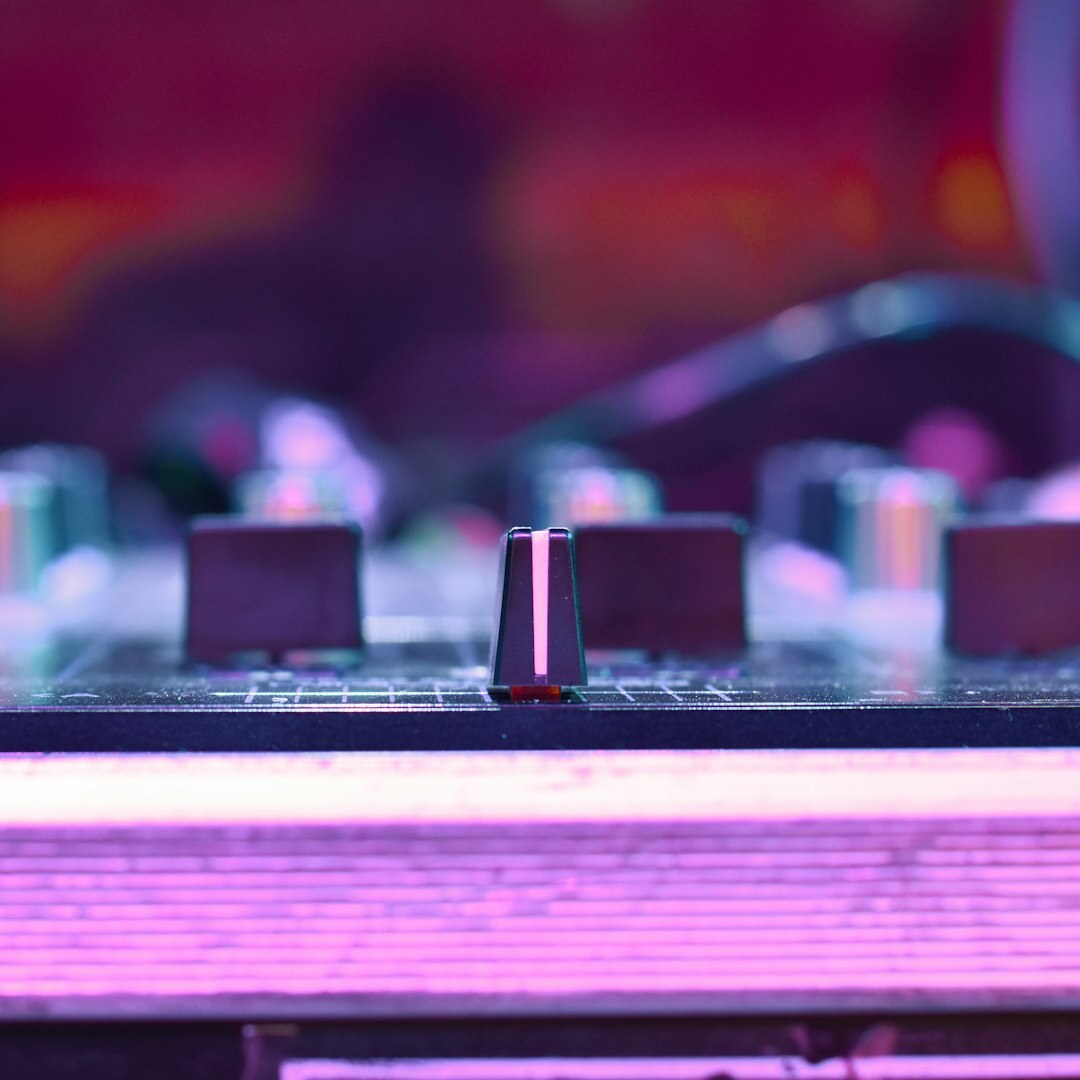 Finnish male sound engineer working at an audio mixing console