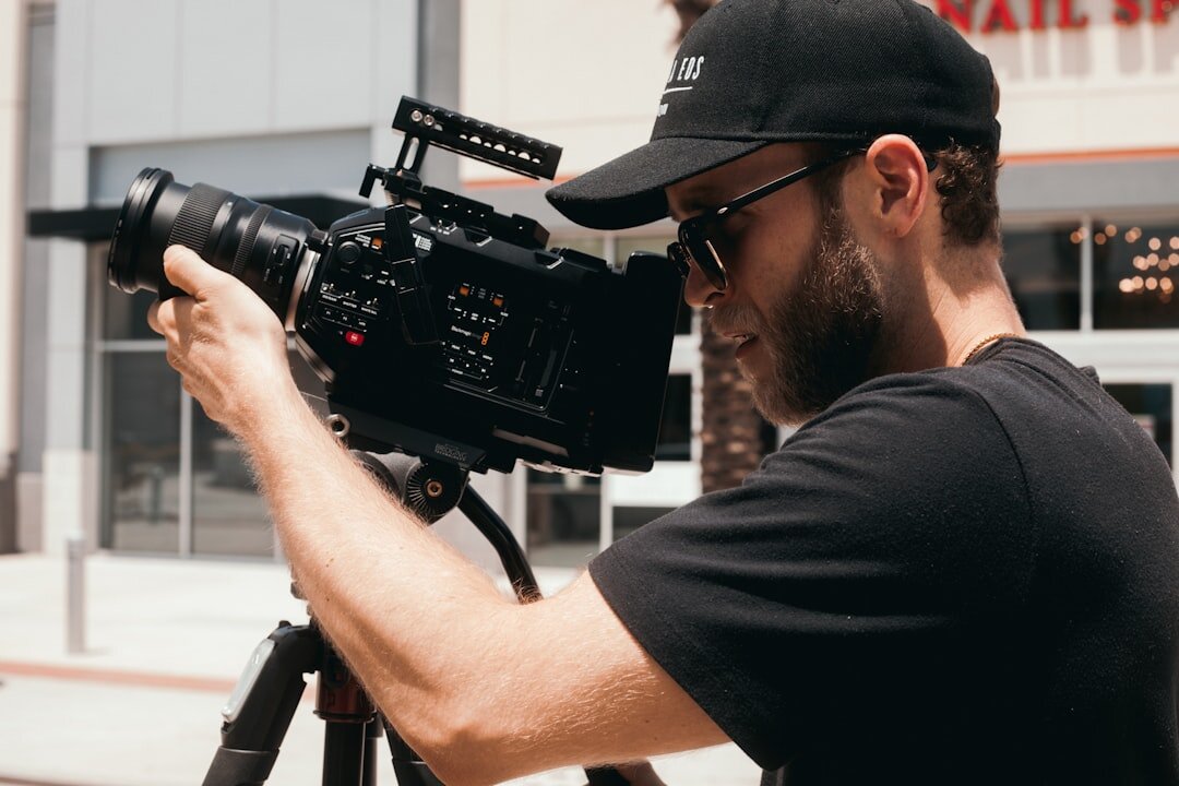 Camera operator panning a broadcast camera during a live segment